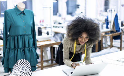 black female designer on her laptop in a design studio